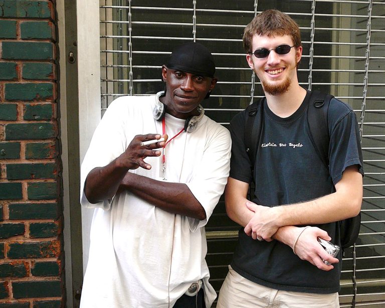 ron stauffer standing with a local man in new orleans